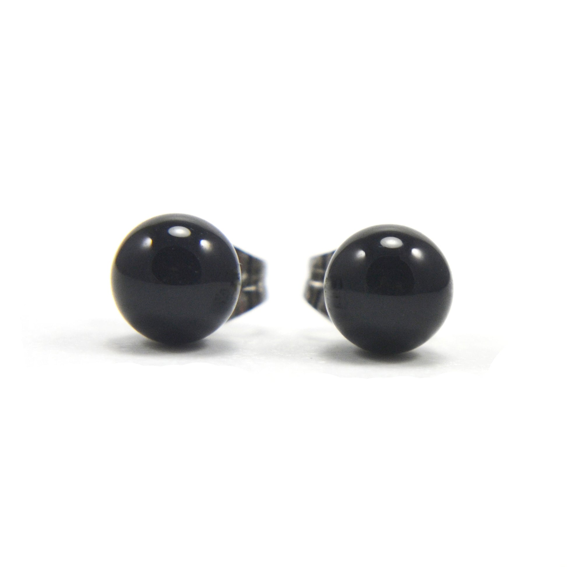 Front view of black Onyx ball stud earrings on white background