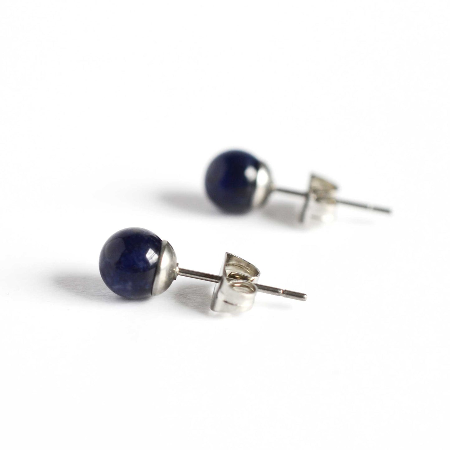 Side view of Sodalite ball stud earrings with hypoallergenic surgical steel posts and backs