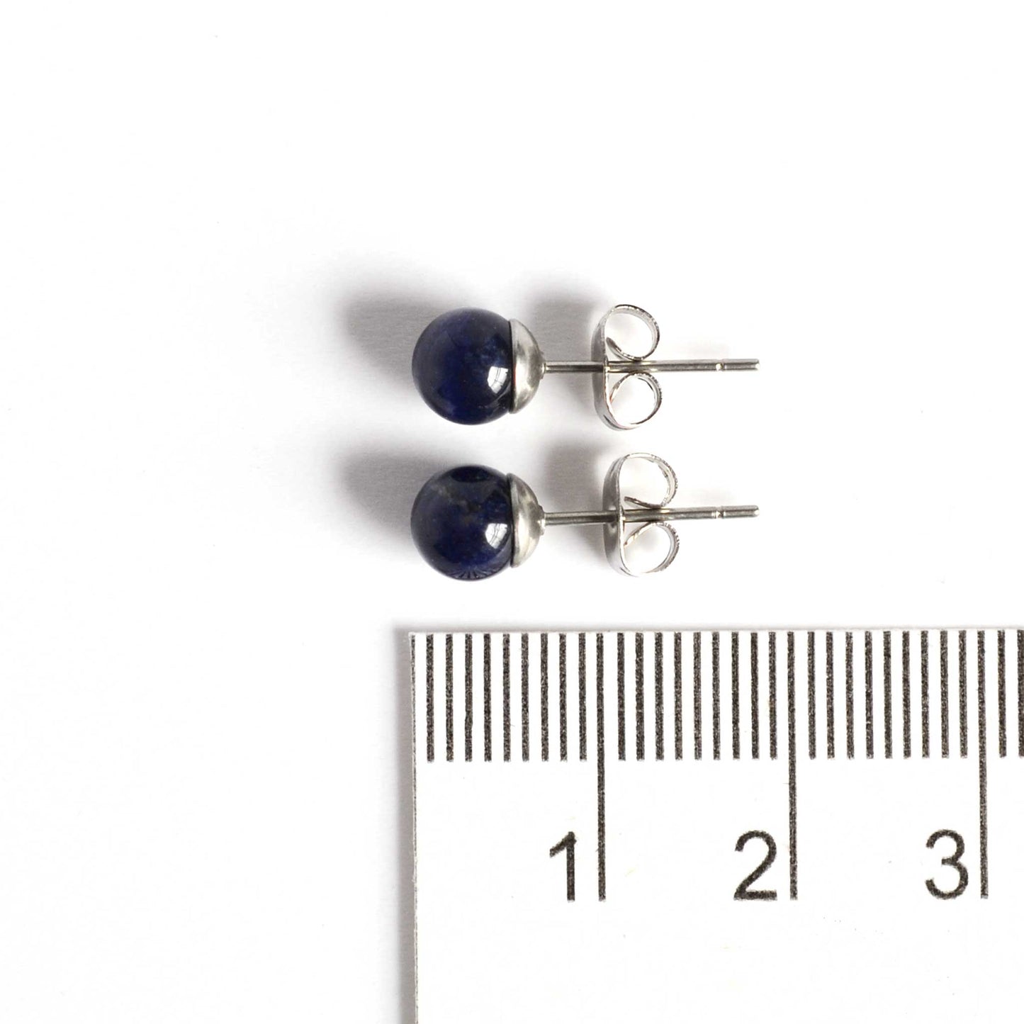 6mm Sodalite ball stud earrings next to ruler