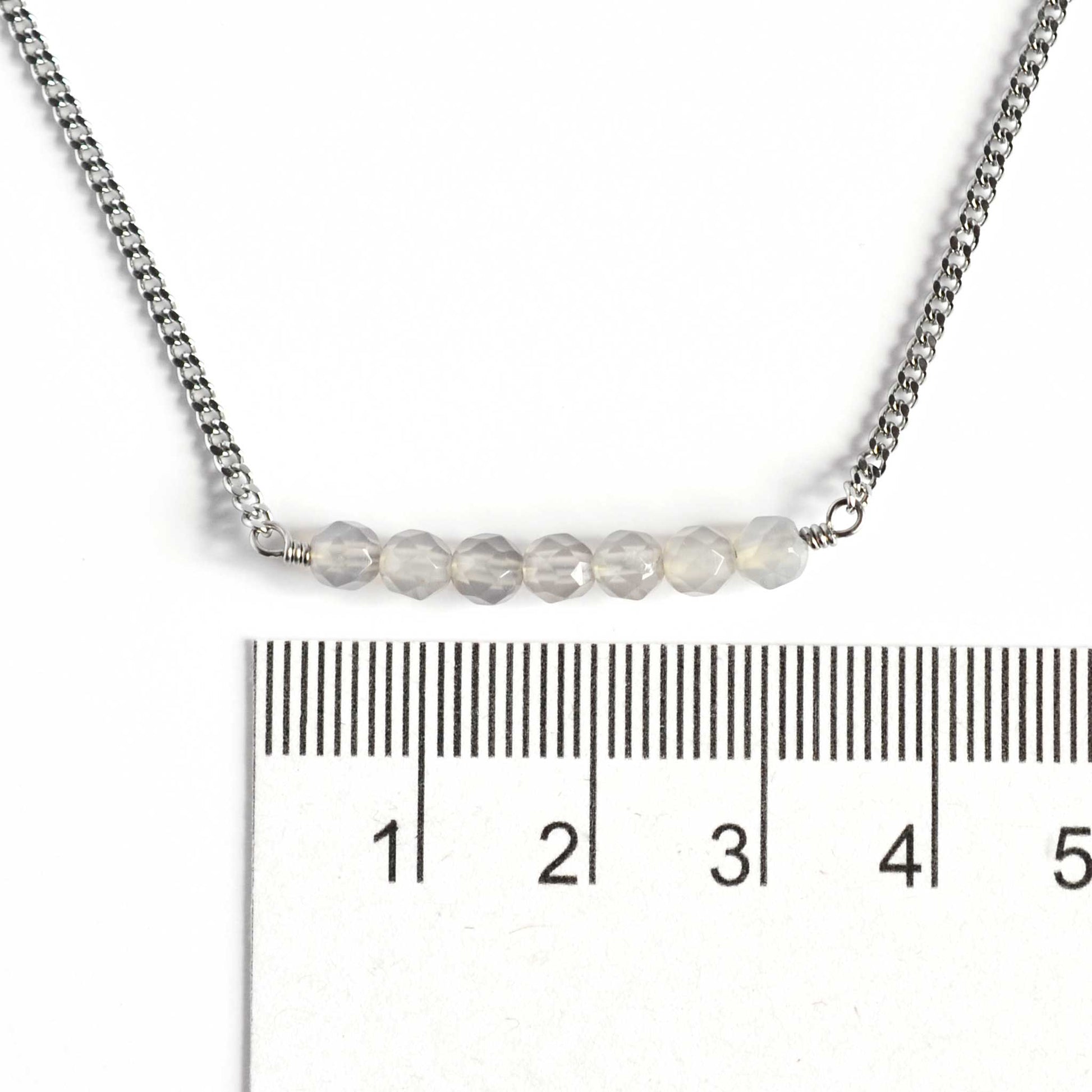 Dainty Grey Agate necklace with 4mm gemstone beads next to ruler