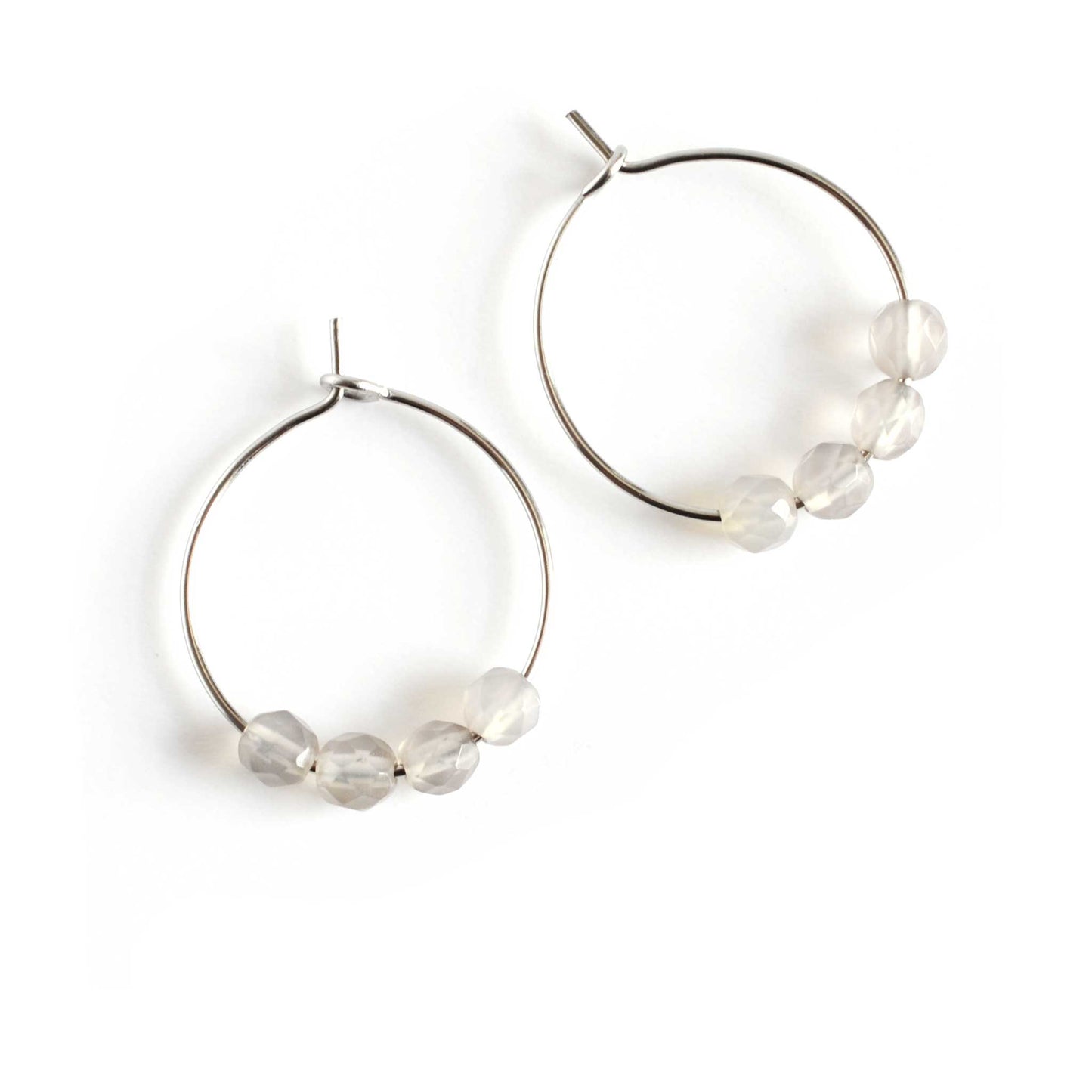 Pair of grey Agate gemstone hoop earrings on white background