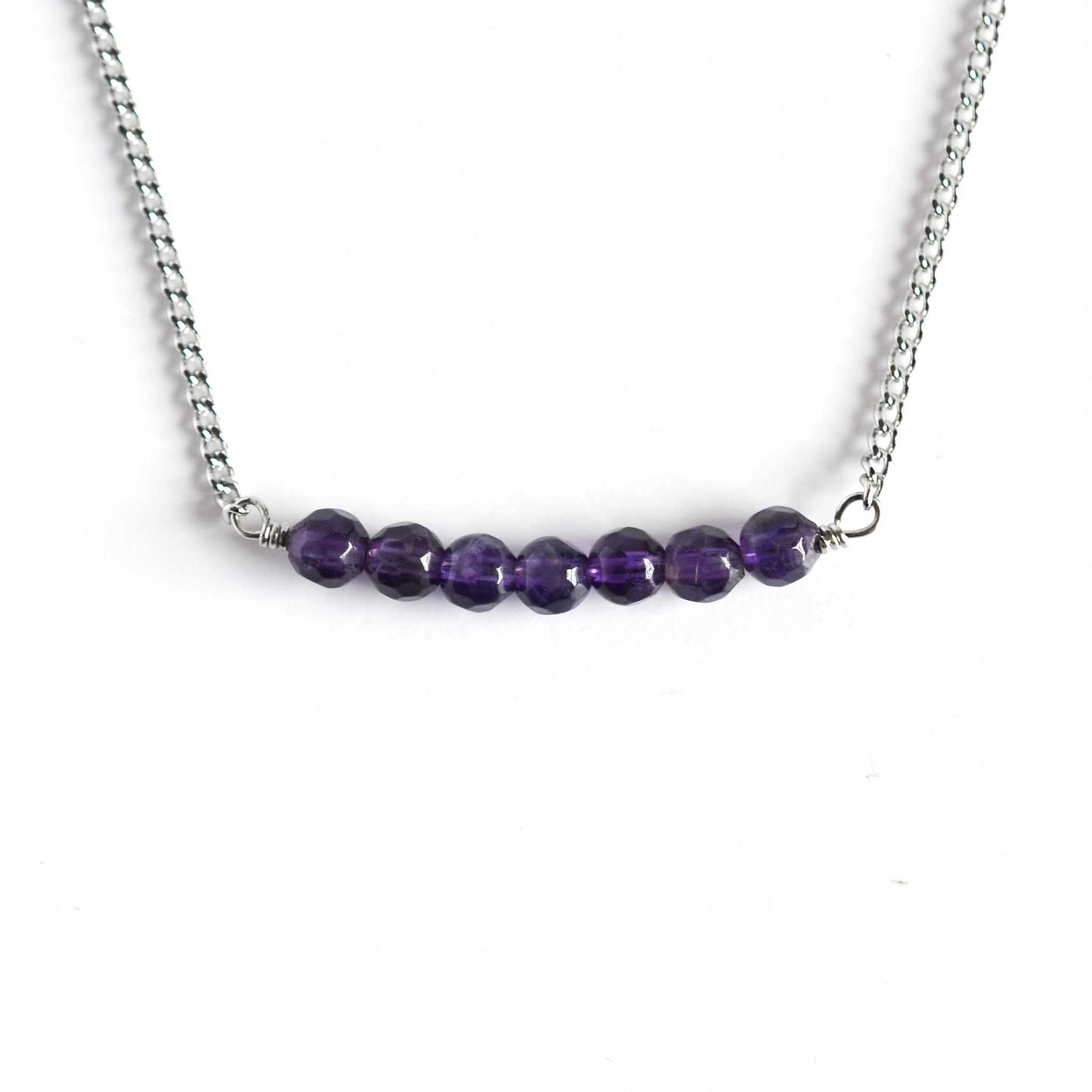Dainty Amethyst necklace with stainless steel chain on white background