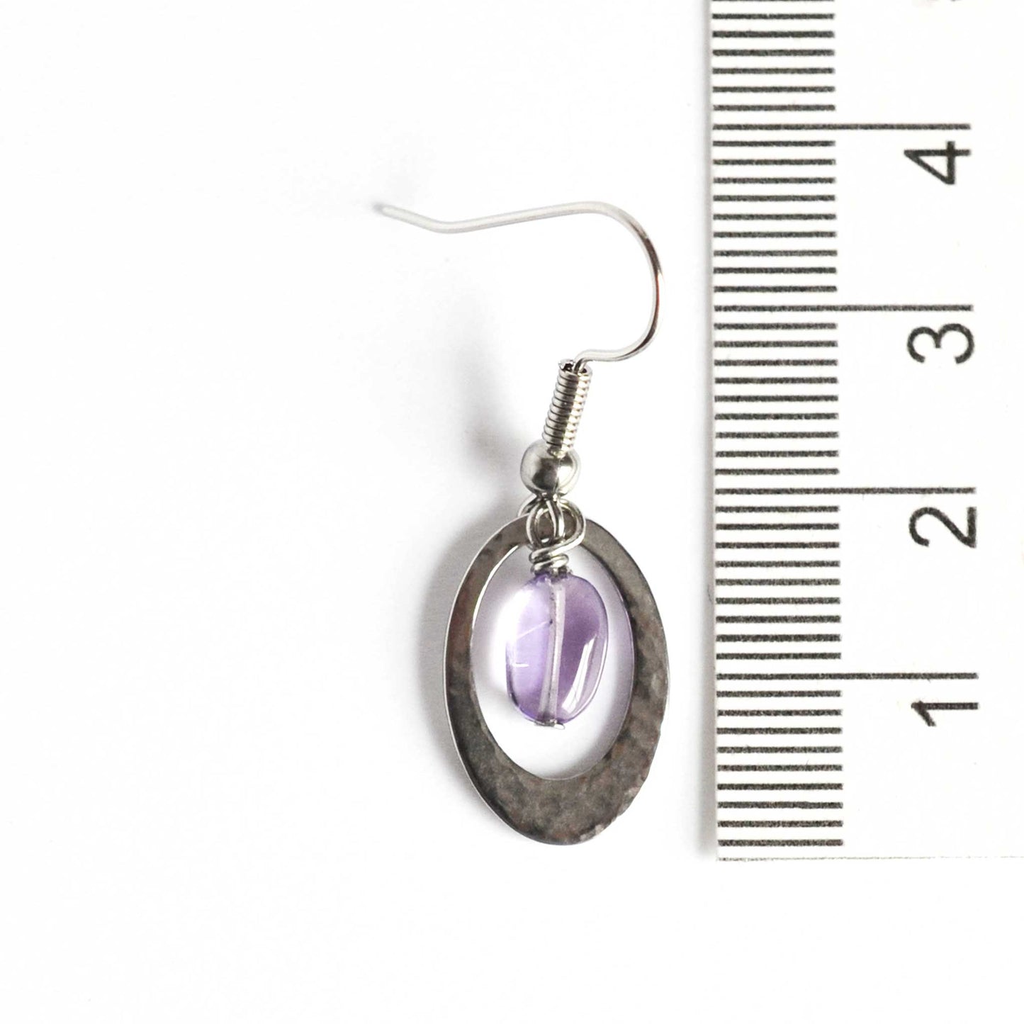 35mm long oval Amethyst drop earrings next to ruler.