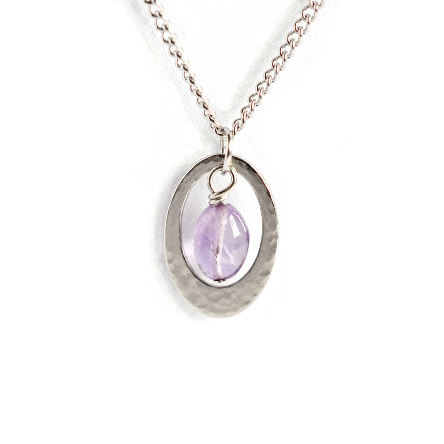 Amethyst and stainless steel oval pendant necklace on white background.