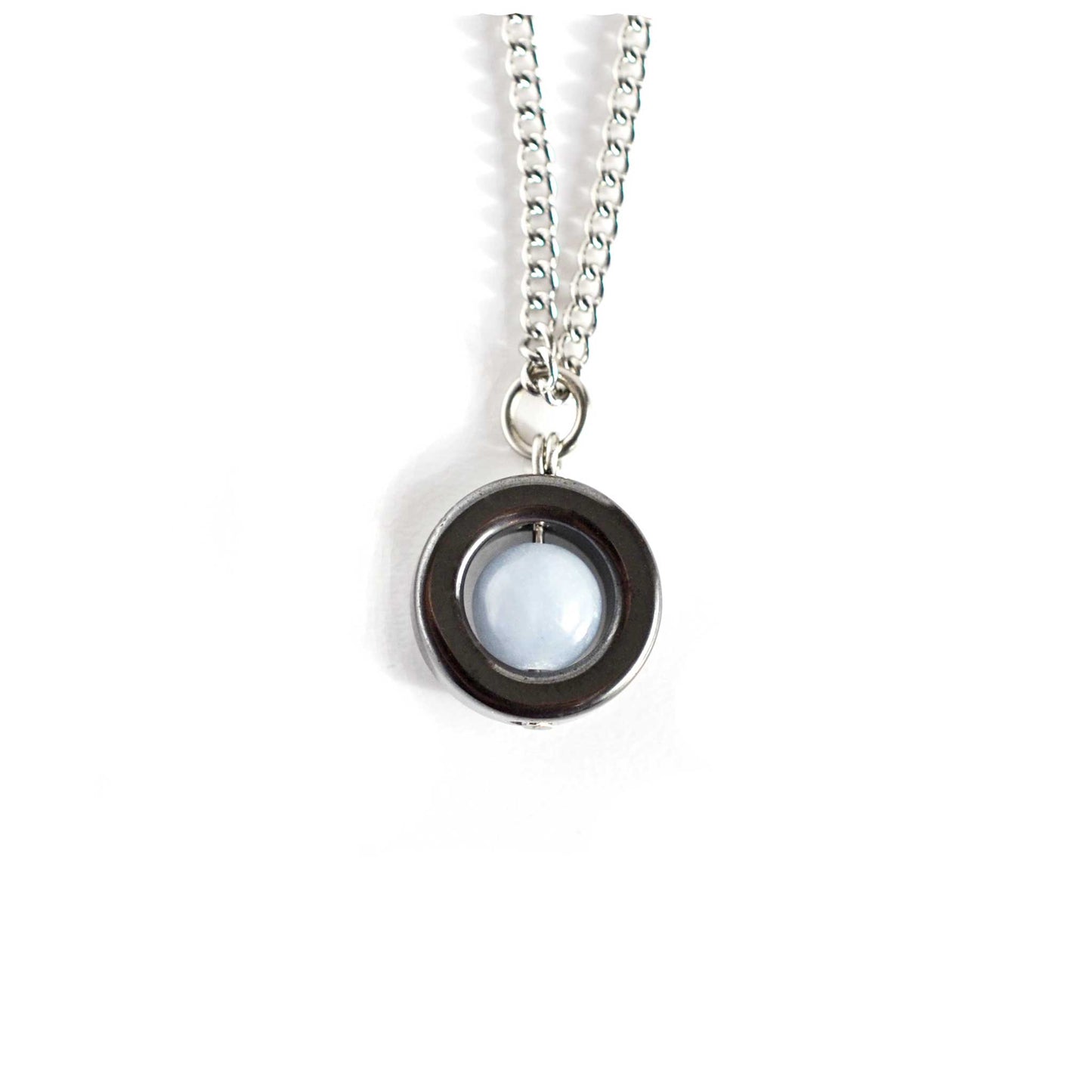Hematite and pale blue Angelite spinner necklace on white background.