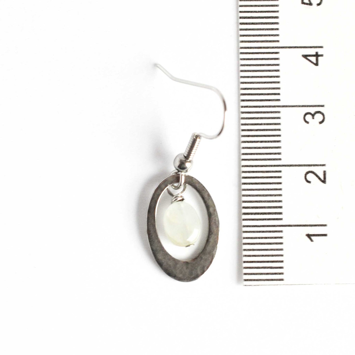 35mm long Aquamarine oval drop earrings next to ruler.