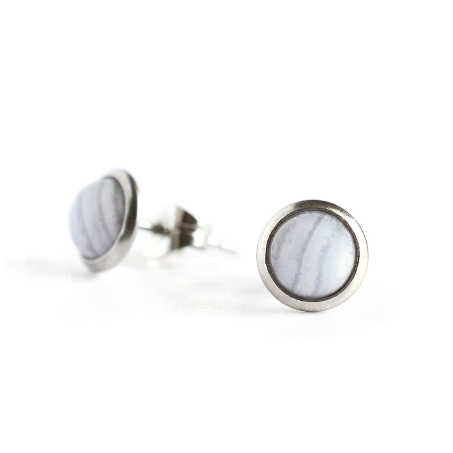 Round Blue Lace Agate and surgical steel stud earrings on white background