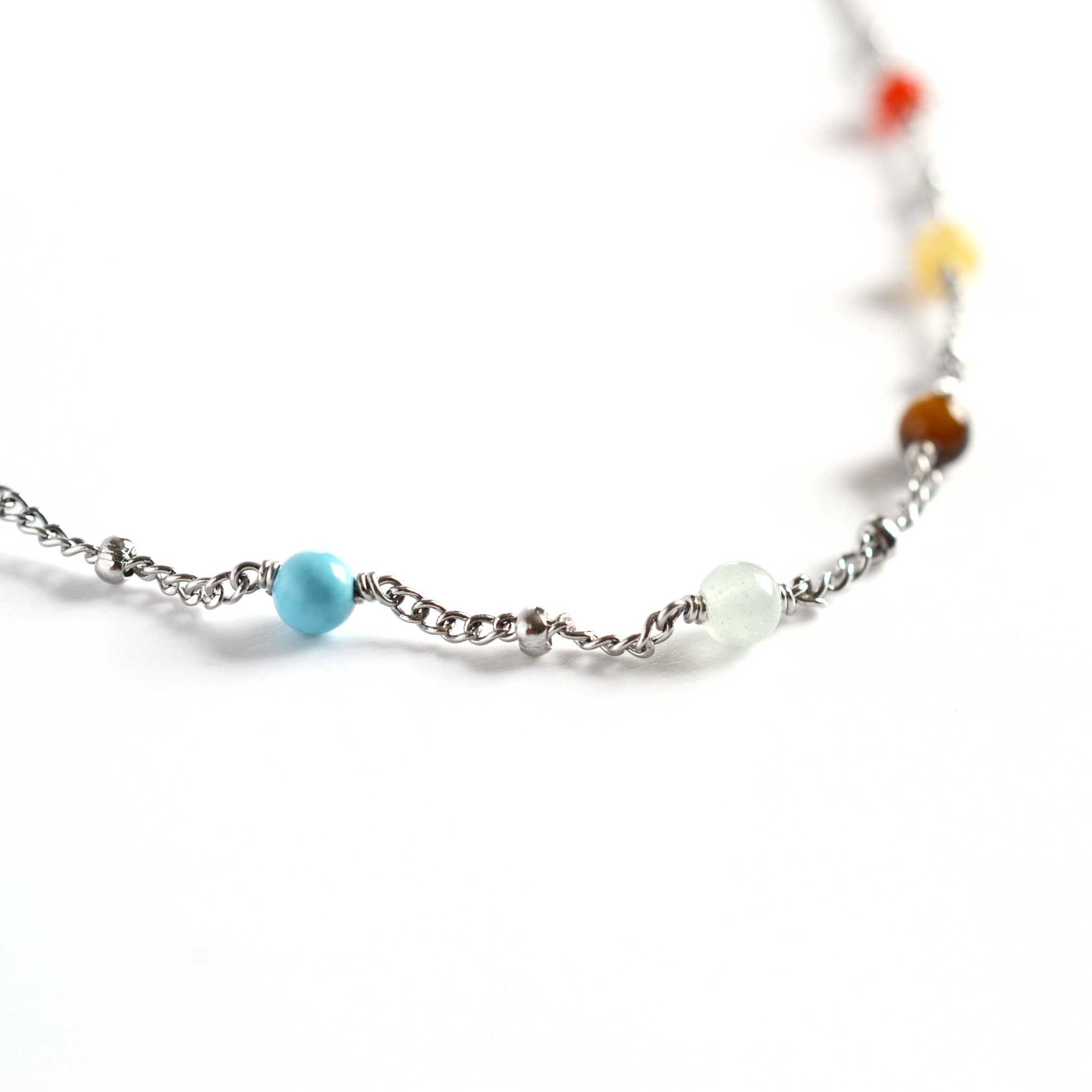 Close up of chakra necklace with seven 4mm round chakra gemstone beads