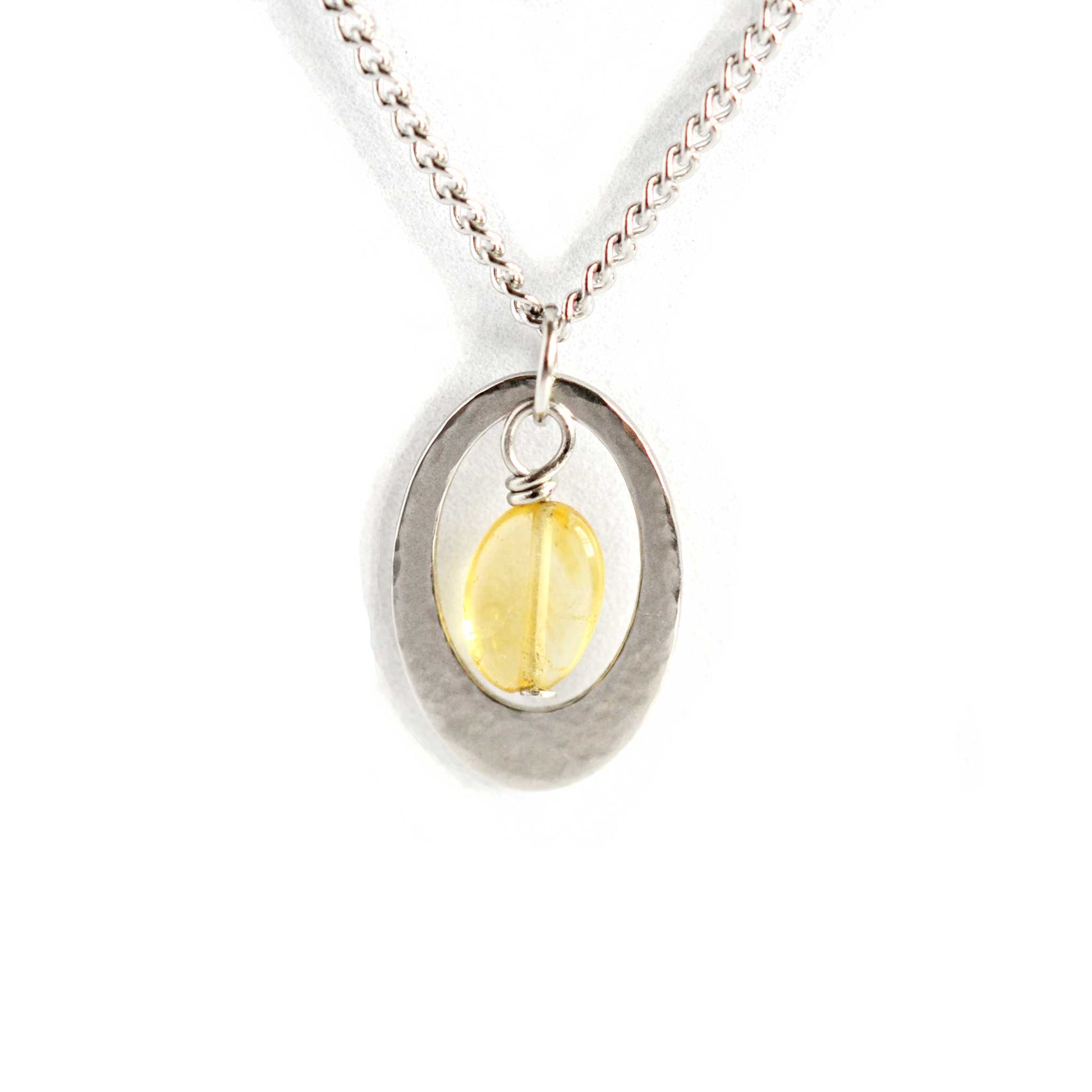 Oval Citrine pendant necklace on stainless steel curb chain.