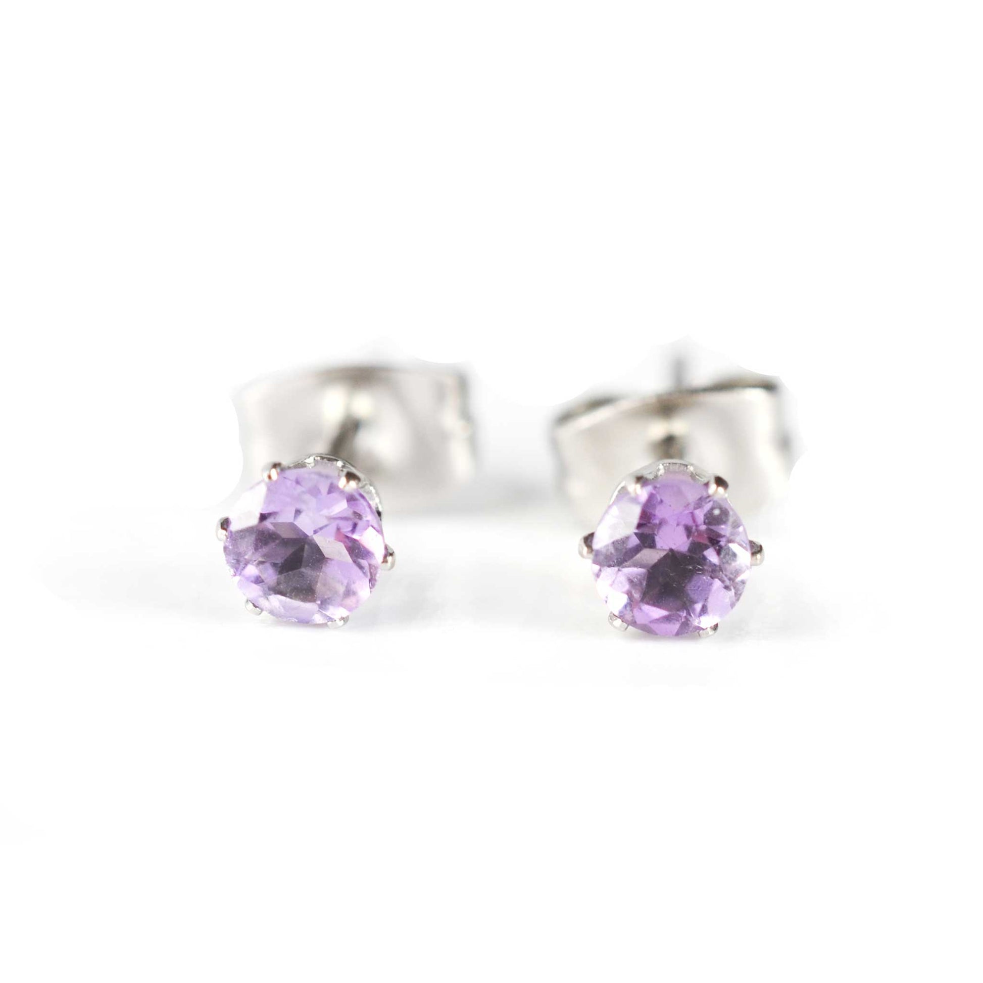 Front view of tiny purple faceted Amethyst stud earrings on white background