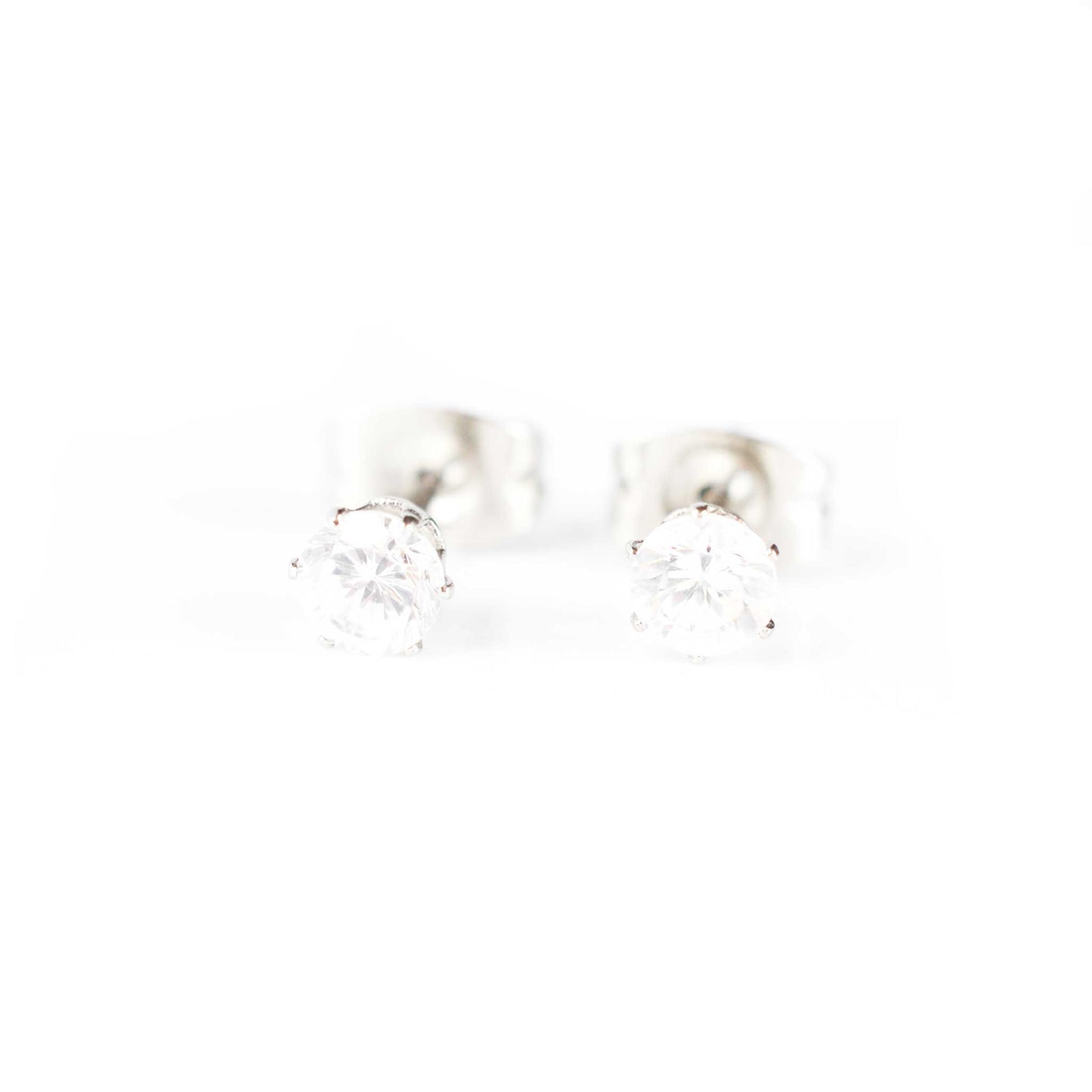 Front view of tiny stud Cubic Zirconia earrings on white background