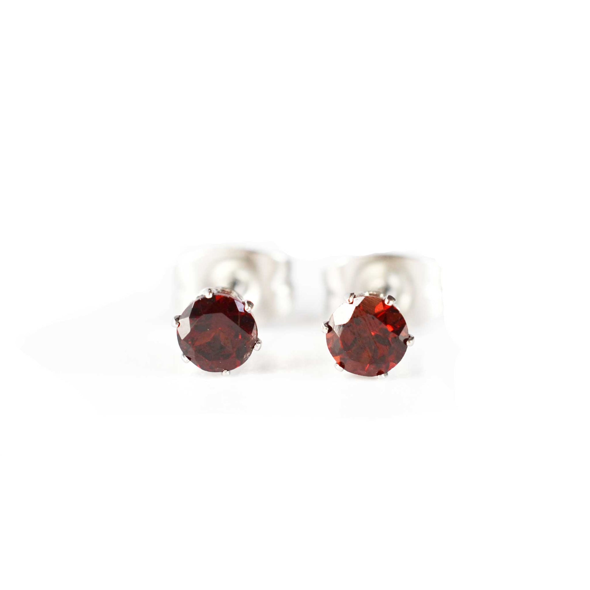 Front view of tiny faceted Garnet gemstone stud earrings on white background
