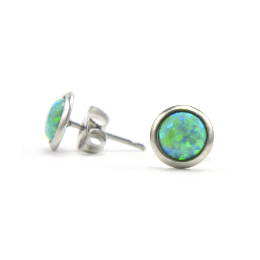 Green Opal stud earrings on white background