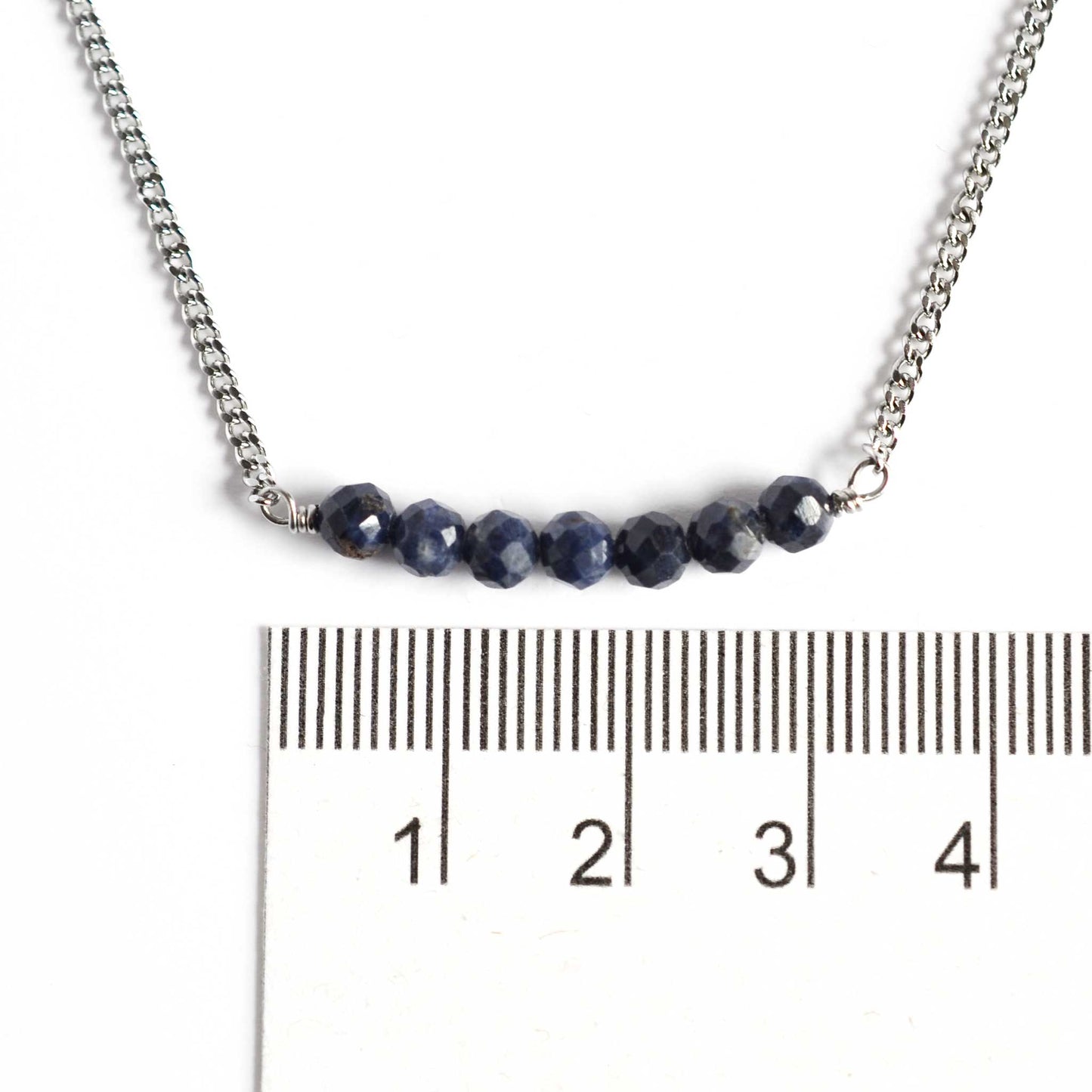 Dainty Sapphire necklace with 4mm gemstone beads next to ruler