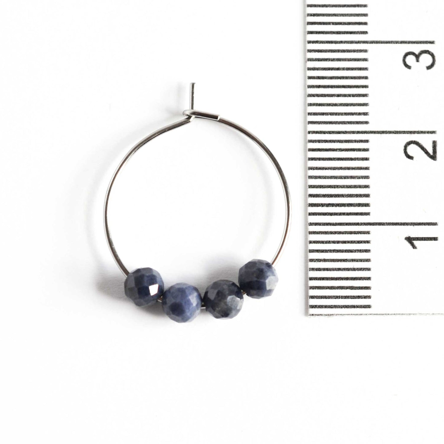 2cm diameter hoop earrings with 4mm Sapphire gemstone beads next to ruler