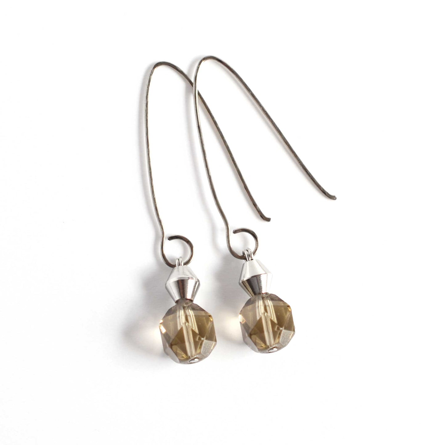 Smoky Quartz drop earrings with Titanium oval hooks laying on white background.