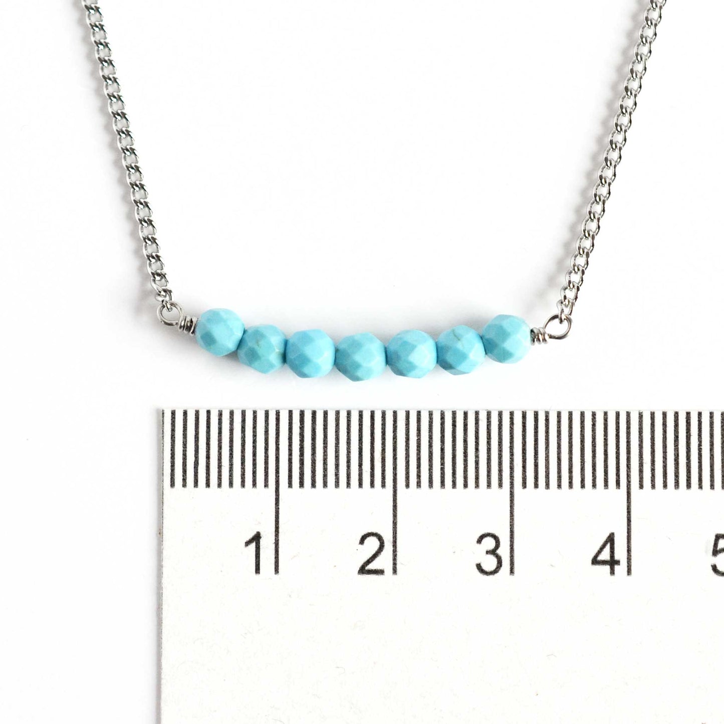 Dainty Turquoise necklace with 4mm beads next to ruler