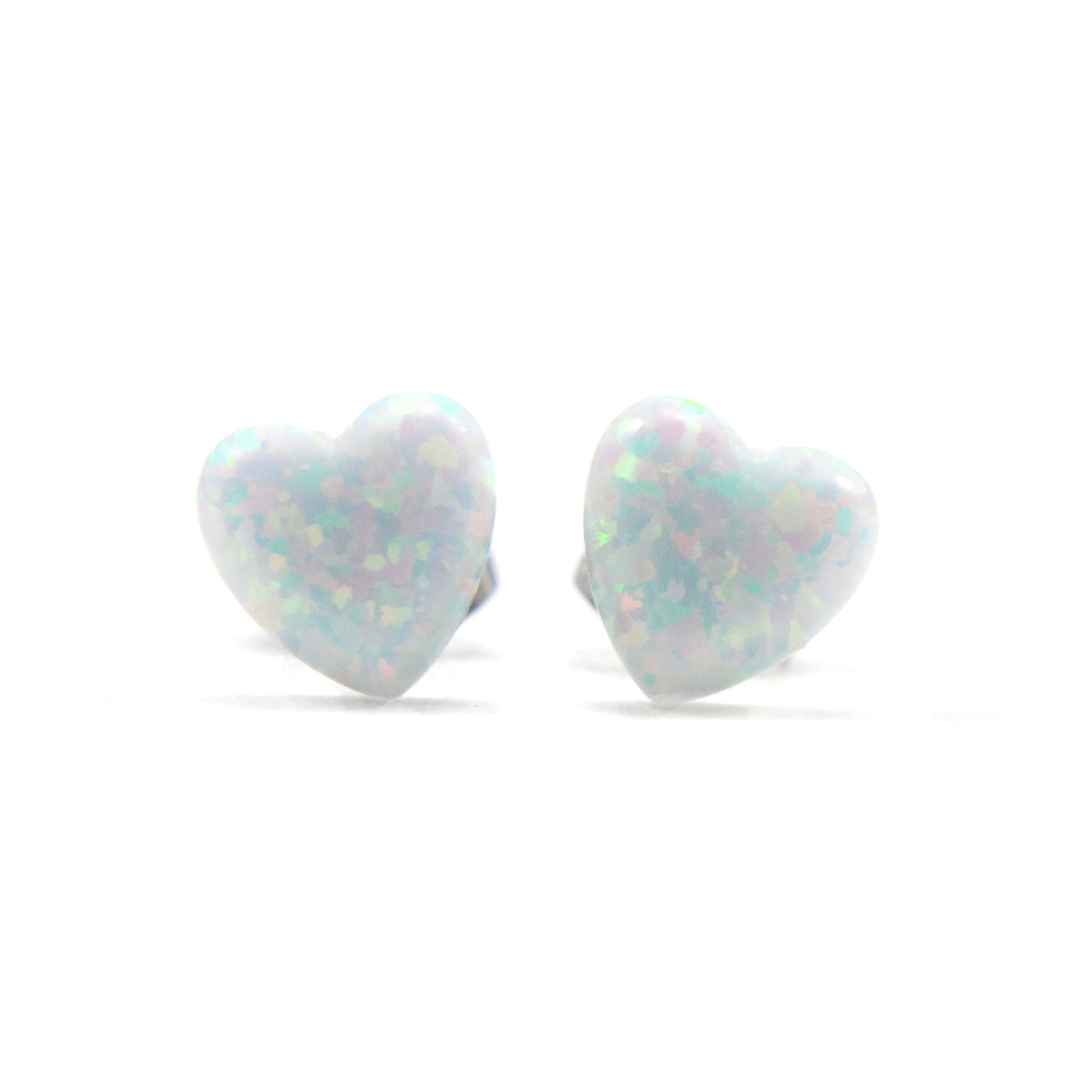 White Opal heart earrings on white background